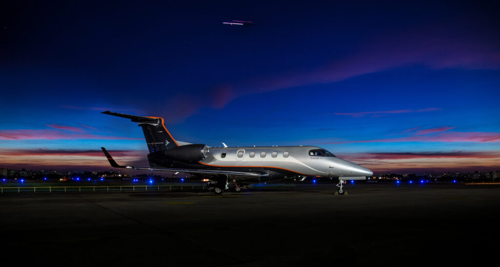 Private jet at sunset on runway